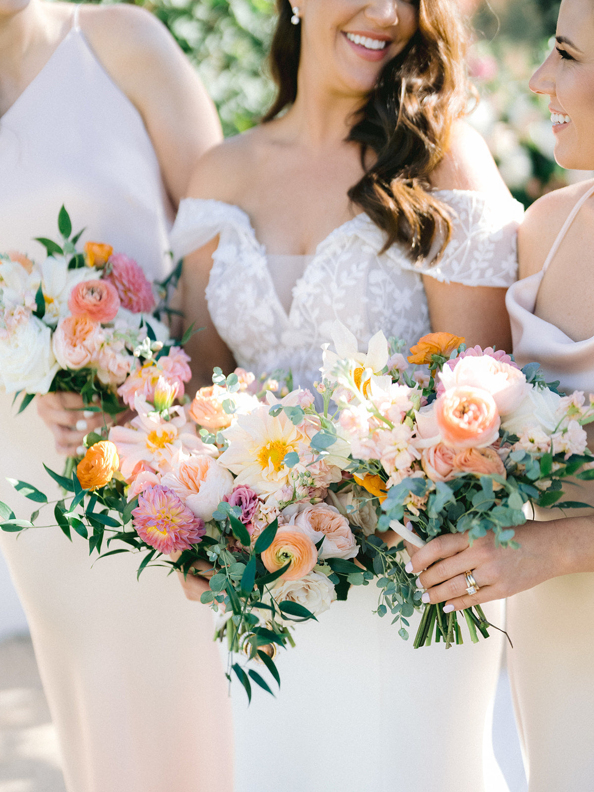 bride and bridesmaids with fall floral bouquets 